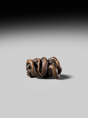 Lot 120 - MASANAO: A FINE WOOD NETSUKE OF A SNAKE PREYING ON A FROG, SANSUKUMI