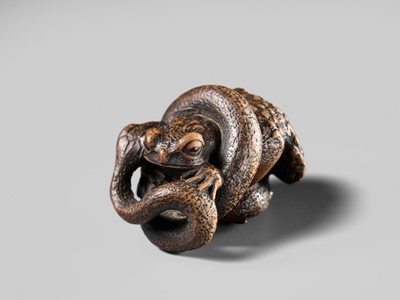 Lot 120 - MASANAO: A FINE WOOD NETSUKE OF A SNAKE PREYING ON A FROG, SANSUKUMI