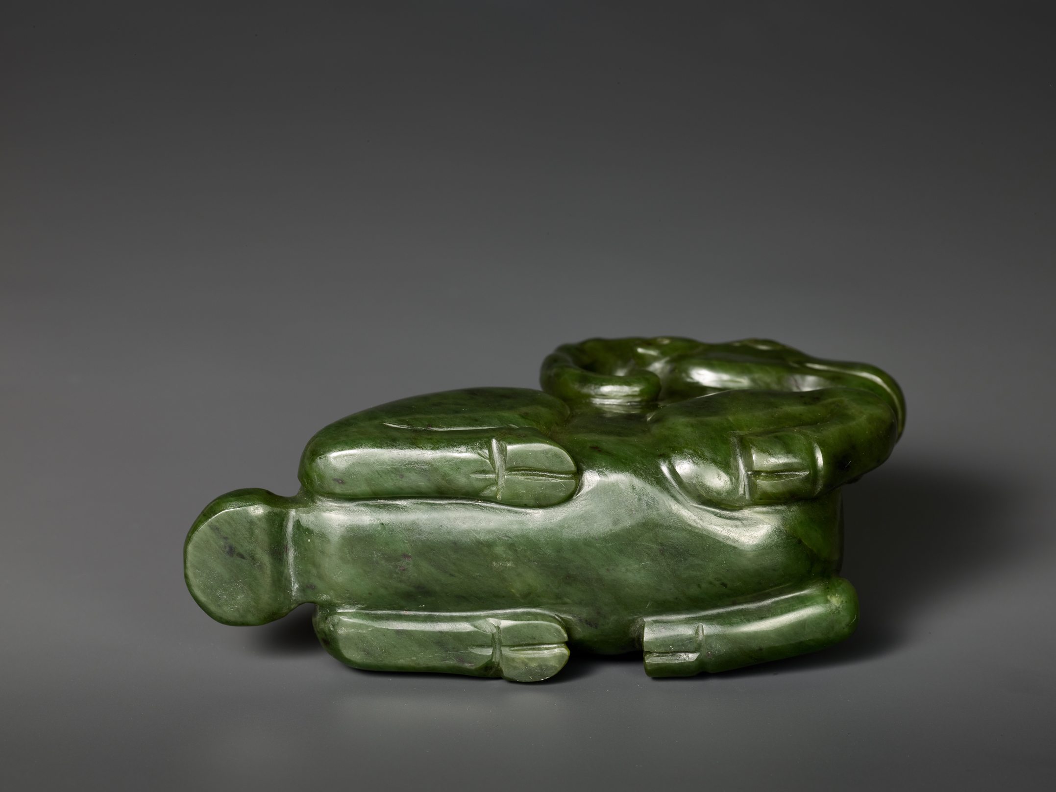 Lot 824 - A MASSIVE SPINACH GREEN JADE MODEL OF A