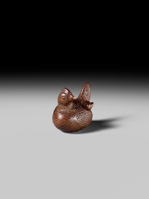 TOMOTSUNE: A SUPERB NAGOYA SCHOOL WOOD NETSUKE OF A HEN WITH TWO CHICKS