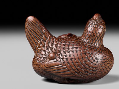 TOMOTSUNE: A SUPERB NAGOYA SCHOOL WOOD NETSUKE OF A HEN WITH TWO CHICKS