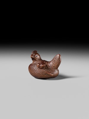 TOMOTSUNE: A SUPERB NAGOYA SCHOOL WOOD NETSUKE OF A HEN WITH TWO CHICKS