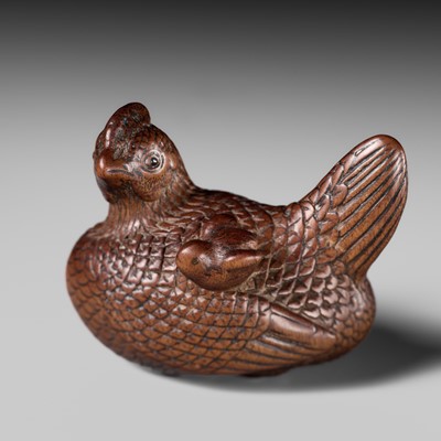 TOMOTSUNE: A SUPERB NAGOYA SCHOOL WOOD NETSUKE OF A HEN WITH TWO CHICKS