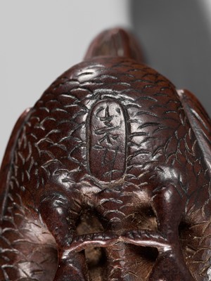 TOMOTSUNE: A SUPERB NAGOYA SCHOOL WOOD NETSUKE OF A HEN WITH TWO CHICKS
