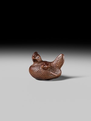 TOMOTSUNE: A SUPERB NAGOYA SCHOOL WOOD NETSUKE OF A HEN WITH TWO CHICKS