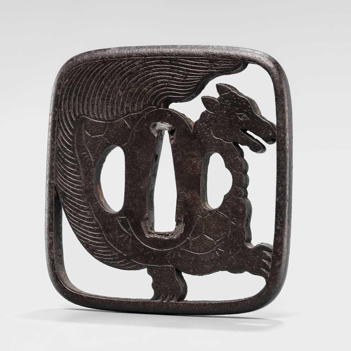 Lot 548 - AN IRON SUKASHI TSUBA OF A MINOGAME, WITH NBTHK TOKUBETSU KICHO CERTIFICATE