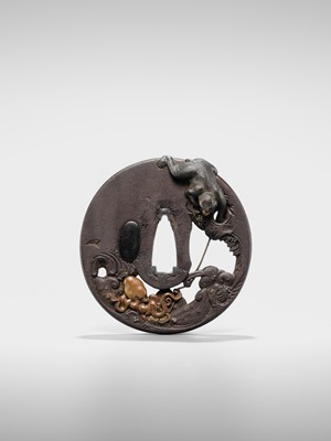 Lot 62 - AN INGENIOUS TETSUGENDO SCHOOL IRON TSUBA WITH A MONKEY CATCHING AN OCTOPUS