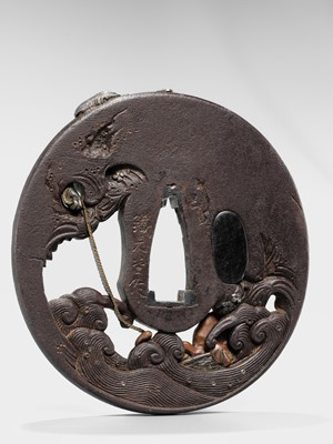 Lot 62 - AN INGENIOUS TETSUGENDO SCHOOL IRON TSUBA WITH A MONKEY CATCHING AN OCTOPUS