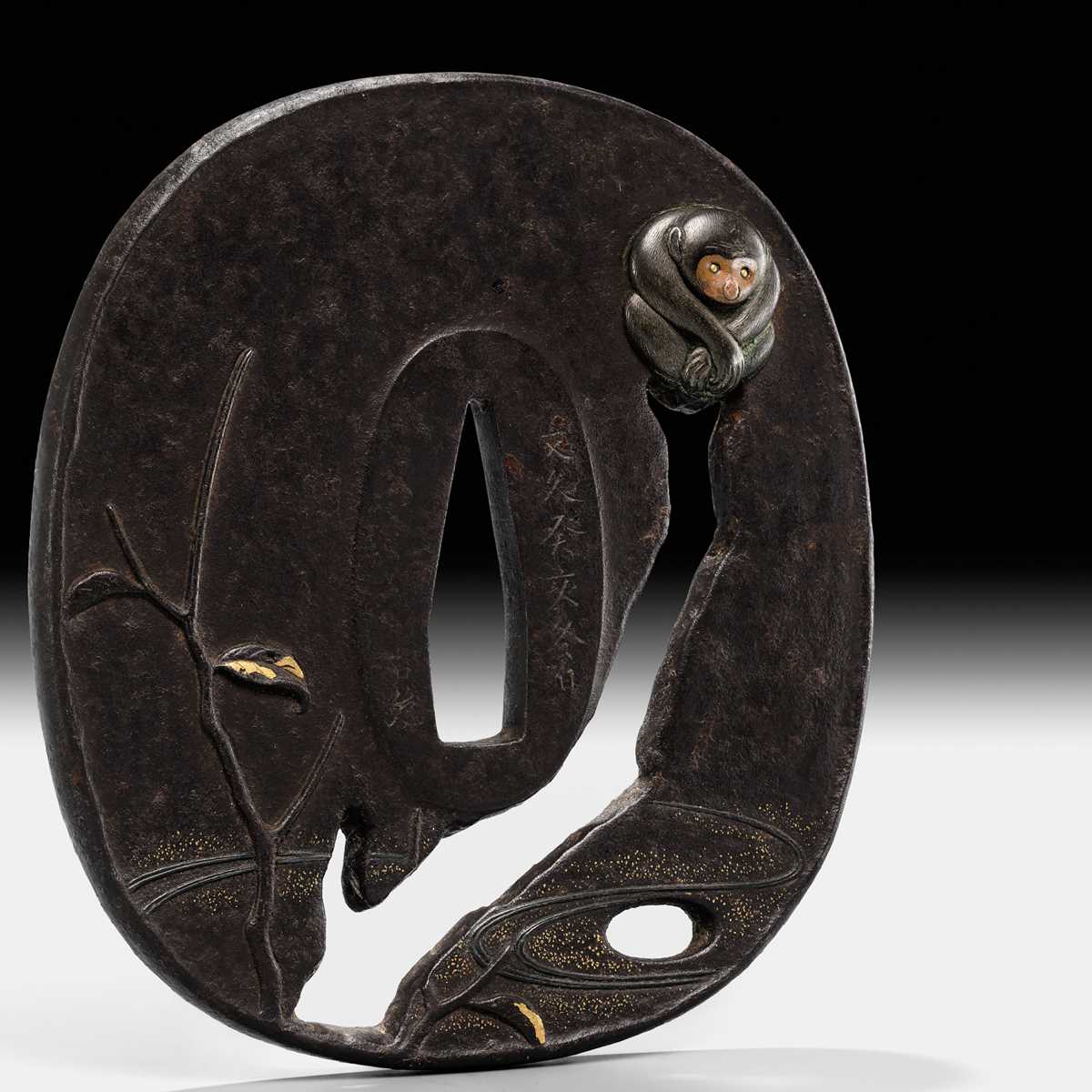 Lot 60 - AN IRON SUKASHI TSUBA WITH MONKEY, DATED 1863