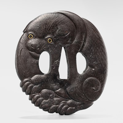 Lot 65 - A SUPERB IRON TSUBA OF A PUPPY WITH GOLD-INLAID EYES