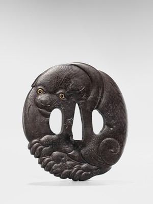 Lot 65 - A SUPERB IRON TSUBA OF A PUPPY WITH GOLD-INLAID EYES