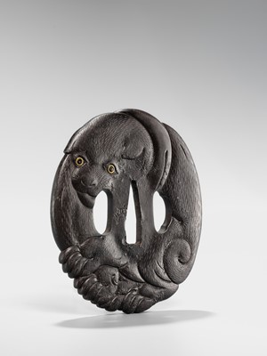Lot 65 - A SUPERB IRON TSUBA OF A PUPPY WITH GOLD-INLAID EYES