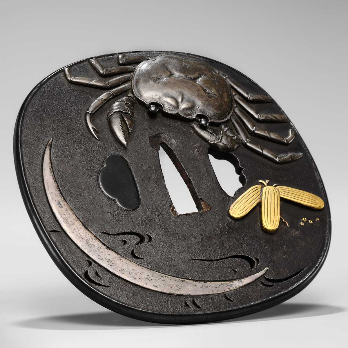 Lot 66 - A SUPERB IRON TSUBA WITH A CRAB AND THE REFLECTION OF A CRESCENT MOON