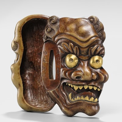 Lot 70 - SEIRYUKEN HIDENOBU: A LARGE AND SUPERB SENTOKU AND SUAKA MITO SCHOOL ‘ONI AND OBESHIMI MASK’ TSUBA