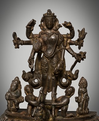 Lot 307 - A BRONZE GROUP OF AMOGHAPASA LOKESHVARA WITH GANESHA, TARA, AND ATTENDANTS, NEPAL OR HIMACHAL PRADESH, 18TH-19TH CENTURY