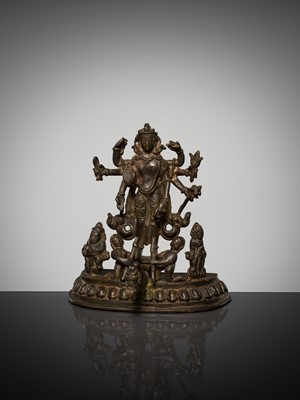 Lot 307 - A BRONZE GROUP OF AMOGHAPASA LOKESHVARA WITH GANESHA, TARA, AND ATTENDANTS, NEPAL OR HIMACHAL PRADESH, 18TH-19TH CENTURY