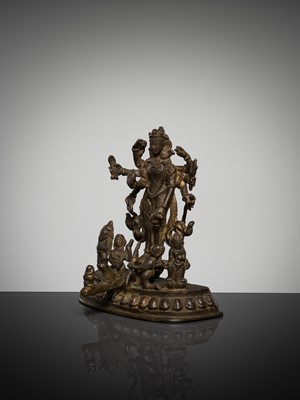 Lot 307 - A BRONZE GROUP OF AMOGHAPASA LOKESHVARA WITH GANESHA, TARA, AND ATTENDANTS, NEPAL OR HIMACHAL PRADESH, 18TH-19TH CENTURY