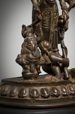 Lot 307 - A BRONZE GROUP OF AMOGHAPASA LOKESHVARA WITH GANESHA, TARA, AND ATTENDANTS, NEPAL OR HIMACHAL PRADESH, 18TH-19TH CENTURY