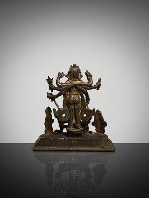 Lot 307 - A BRONZE GROUP OF AMOGHAPASA LOKESHVARA WITH GANESHA, TARA, AND ATTENDANTS, NEPAL OR HIMACHAL PRADESH, 18TH-19TH CENTURY