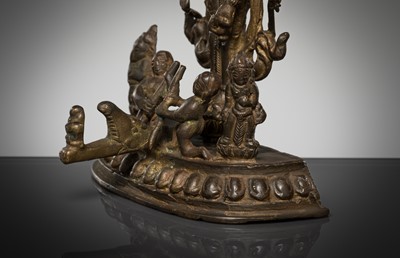 Lot 307 - A BRONZE GROUP OF AMOGHAPASA LOKESHVARA WITH GANESHA, TARA, AND ATTENDANTS, NEPAL OR HIMACHAL PRADESH, 18TH-19TH CENTURY