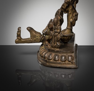 Lot 307 - A BRONZE GROUP OF AMOGHAPASA LOKESHVARA WITH GANESHA, TARA, AND ATTENDANTS, NEPAL OR HIMACHAL PRADESH, 18TH-19TH CENTURY