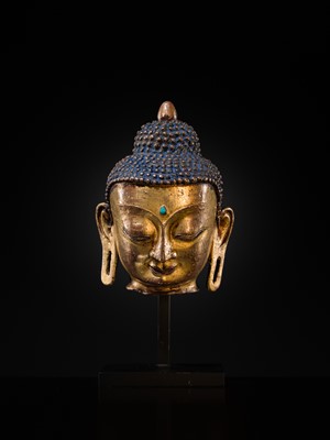 Lot 12 - A SILVER AND COPPER-INLAID GILT-BRONZE HEAD OF BUDDHA, 17TH CENTURY