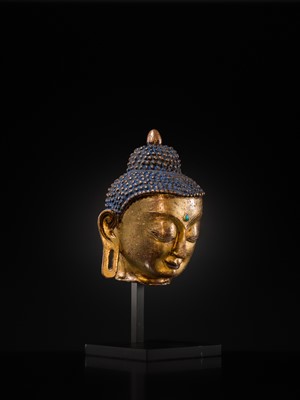 Lot 12 - A SILVER AND COPPER-INLAID GILT-BRONZE HEAD OF BUDDHA, 17TH CENTURY