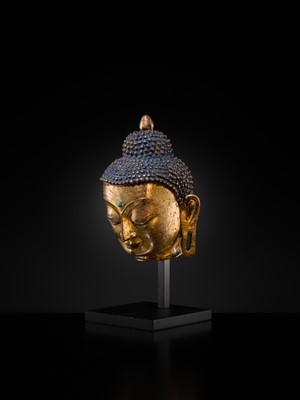 Lot 12 - A SILVER AND COPPER-INLAID GILT-BRONZE HEAD OF BUDDHA, 17TH CENTURY