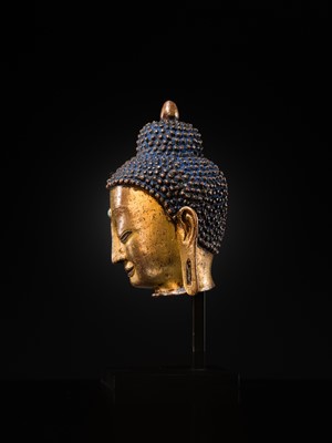 Lot 12 - A SILVER AND COPPER-INLAID GILT-BRONZE HEAD OF BUDDHA, 17TH CENTURY