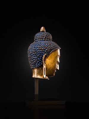 Lot 12 - A SILVER AND COPPER-INLAID GILT-BRONZE HEAD OF BUDDHA, 17TH CENTURY