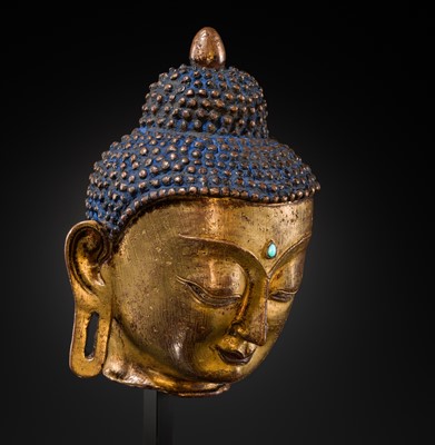 Lot 12 - A SILVER AND COPPER-INLAID GILT-BRONZE HEAD OF BUDDHA, 17TH CENTURY
