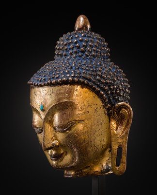 Lot 12 - A SILVER AND COPPER-INLAID GILT-BRONZE HEAD OF BUDDHA, 17TH CENTURY