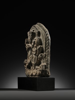 Lot 298 - A GRAY STONE STELE OF VISHNU AND LAKSHMI, NEPAL, 15TH-16TH CENTURY