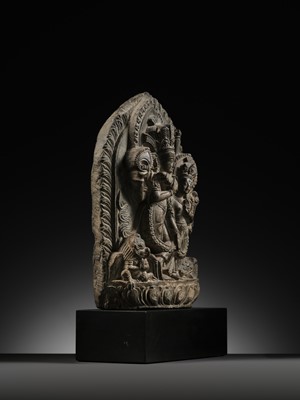 Lot 298 - A GRAY STONE STELE OF VISHNU AND LAKSHMI, NEPAL, 15TH-16TH CENTURY