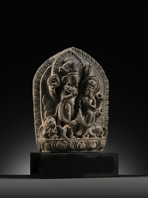 Lot 298 - A GRAY STONE STELE OF VISHNU AND LAKSHMI, NEPAL, 15TH-16TH CENTURY