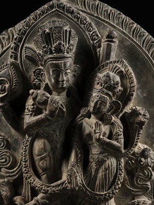Lot 298 - A GRAY STONE STELE OF VISHNU AND LAKSHMI, NEPAL, 15TH-16TH CENTURY