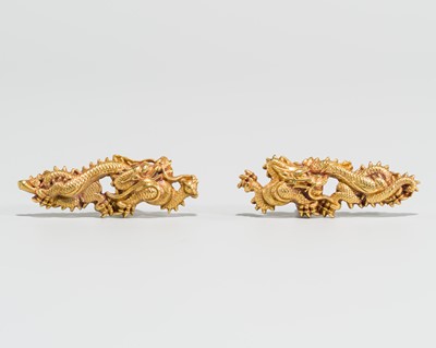 Lot 645 - A PAIR OF GOTO SCHOOL SOLID GOLD MENUKI DEPICTING DRAGONS, WITH NBTHK HOZON CERTIFICATE