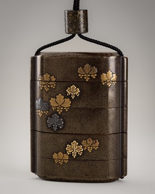 Lot 1138 - A LACQUERED AND INLAID FOUR-CASE INRO WITH PAULOWNIA CRESTS, OJIME, AND NETSUKE