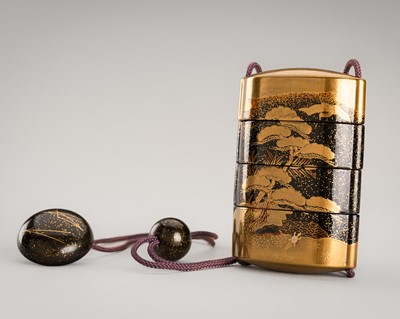 Lot 1145 - A LARGE AND SIGNED THREE-CASE LACQUER INRO WITH PINE TREES AND A NETSUKE