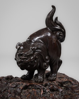 Lot 2 - A LARGE BRONZE OKIMONO OF A SNARLING SHISHI ON A MAGNIFICENT ROOT WOOD STAND