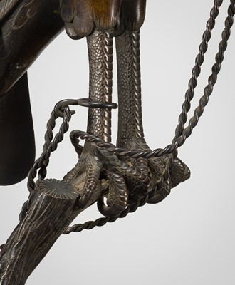 Lot 52 - A BRONZE ‘TETHERED HAWK’ KORO (INCENSE BURNER) AND COVER