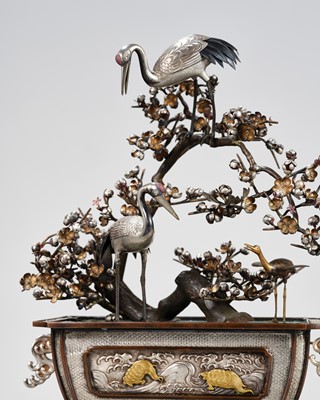 Lot 55 - A SUPERB SILVER AND MIXED METAL OKIMONO DEPICTING CRANES AND PRUNUS, WITH EN SUITE LACQUER STAND