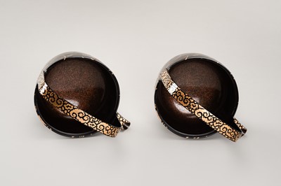 Lot 129 - A PAIR OF BLACK AND GOLD LACQUER CHOSHI (SAKE EWERS) AND COVERS