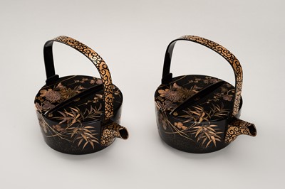 Lot 129 - A PAIR OF BLACK AND GOLD LACQUER CHOSHI (SAKE EWERS) AND COVERS