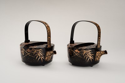 Lot 129 - A PAIR OF BLACK AND GOLD LACQUER CHOSHI (SAKE EWERS) AND COVERS