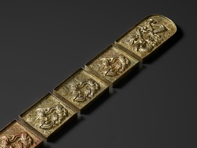 Lot 706 - A SET OF EIGHT GILT COPPER REPOUSSÉ BELT PLAQUES, YUAN STYLE, QING DYNASTY OR EARLIER