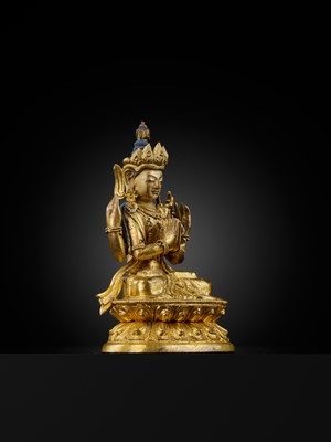 Lot 12 - A GILT-BRONZE FIGURE OF SHADAKSHARI LOKESHVARA, 18TH CENTURY