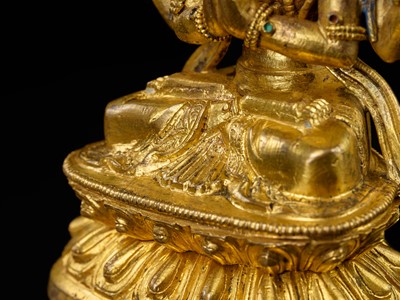 Lot 12 - A GILT-BRONZE FIGURE OF SHADAKSHARI LOKESHVARA, 18TH CENTURY