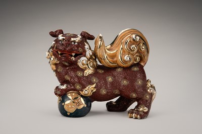 Lot 205 - AN IMARI PORCELAIN FIGURE OF A SHISHI WITH BALL
