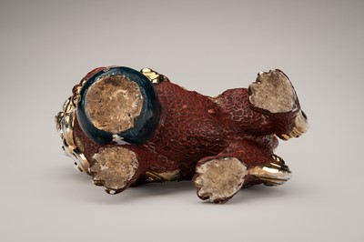 Lot 205 - AN IMARI PORCELAIN FIGURE OF A SHISHI WITH BALL